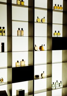 the shelves are filled with different types of bottles