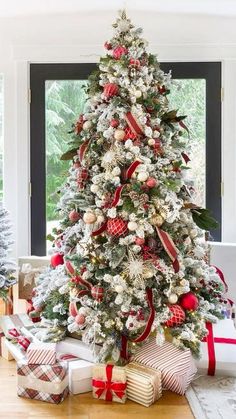 a decorated christmas tree with presents under it