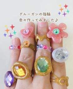 there are five rings with different designs on each ring and one has a flower in the middle