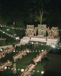 an outdoor wedding reception set up at night