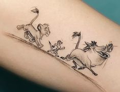 the lion and the mouse are running across the field tattoo on the right arm, which is drawn in black ink