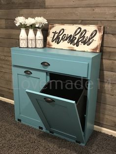 a blue cabinet with a sign that says thank you