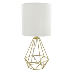 a gold metal table lamp with a white shade on the base and a white fabric lampshade