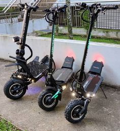 two electric scooters parked next to each other