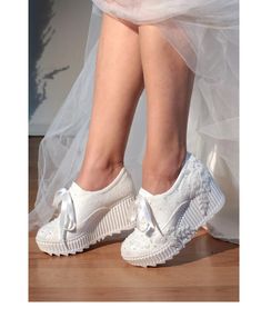 Hi ladies, The favorite choice of brides and brides-to-be. The heel length does not tire you, you will be comfortable all day long. It's your right to be stylish and comfortable during your wedding photo shoot. I hope it brings you happiness on your beautiful days. Heel length is 7 cm. It is a full mold. Please order according to your exact size. Bridal Wedding Shoes With White Laces, White Wedge Heel Wedding Shoes, White Lace Wedding Shoes For Bride, White Lace Wedding Shoes, Wedding Platform Heels, Sneaker Wedding, Shoe Wedges, White Lace Shoes, Wedding Shoes Sneakers