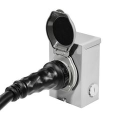 a black and white photo of a microphone attached to a wall mounted device with an extension cord