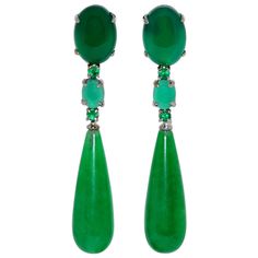 These sumptuous chandelier earrings are truly an exceptional piece of jewellery. Crafted from the highest quality 18-carat rhodium-plated black gold, these earrings offer an elegant and durable finish that will stand the test of time. Each earring is adorned with a beautiful cabochon of green jade, a gemstone known for its natural beauty and hardness. The rounded shape of the cabochon adds a soft and feminine touch to the design of the earrings. At the centre of each earring are two brilliant-cu Chandelier Contemporary, Diamond Chandelier Earrings, Diamond Chandelier, Silver Chandelier Earrings, Gold Chandelier Earrings, Types Of Earrings, Jewellery Marketing, Jade Earrings, Gold Chandelier