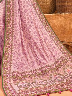 Adorn yourself in the exquisite charm of this pink banarasi silk saree, a testament to timeless beauty and sophistication. The lustrous silk material drapes gracefully, creating an enchanting canvas for the meticulous kachhi work, delicate diamond embellishments, and mesmerizing mirror work.
The ensemble is completed with a matching silk blouse, mirroring the saree's elegance with kachhi work, diamond detailing, and mirror work. The unstitched blouse material allows for customization, ensuring a Pink Raw Silk Pre-draped Saree With Resham Embroidery, Festive Pink Silk Pre-draped Saree, Transitional Pink Raw Silk Pre-draped Saree, Pink Raw Silk Pre-draped Saree With Dupatta, Pink Silk Pre-draped Saree With Cutdana, Pink Pre-draped Saree In Raw Silk With Resham Embroidery, Traditional Pink Pre-draped Saree In Chanderi, Traditional Pink Pre-draped Chanderi Saree, Transitional Pink Chanderi Pre-draped Saree