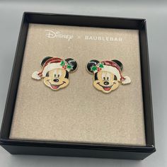 pair of mickey and minnie mouse christmas earrings in gift box with disney x baublebar logo