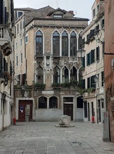 an old building with lots of windows and doors