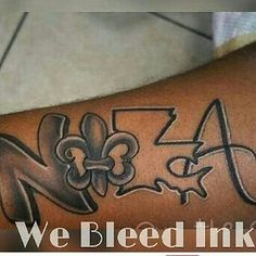 a person with a tattoo on their arm that says we bleed inked 4x4