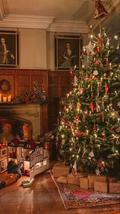 a living room with a christmas tree in the corner and presents on the floor next to it