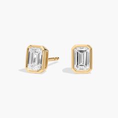 Beautifully matched, these diamond stud earrings feature emerald cut, near-colorless diamonds set in 14k yellow gold with bezel settings Pearl Jewelry Gift, Pearl Bracelet Gold, Platinum Rose Gold, Gold Rings Fashion, Colorless Diamond, Gold Pearl Necklace, Ladies Diamond Rings, Diamond Stud Earrings, Diamond Shop