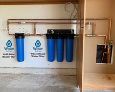 three water filtrators are hanging on the wall