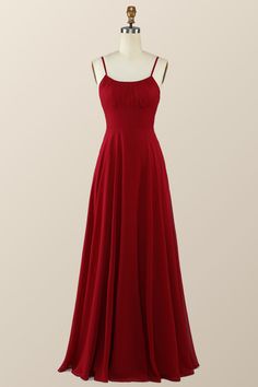 This beautiful dress features a wine red hue and elegant chiffon fabric with spaghetti straps, an empire neckline, and a zip-up back. It's the perfect full-length look! Elegant Red Chiffon Prom Dress, Red Chiffon Bridesmaid Evening Dress, Red Chiffon Dress With Spaghetti Straps, Red Chiffon Maxi Dress For Bridesmaids, Red Spaghetti Strap Bridesmaid Dress, Empire Neckline, Sweep Train Prom Dress, Wine Red Color, Prom Dresses With Pockets