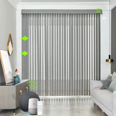 the living room is decorated in white and grey tones with green arrows pointing to different areas