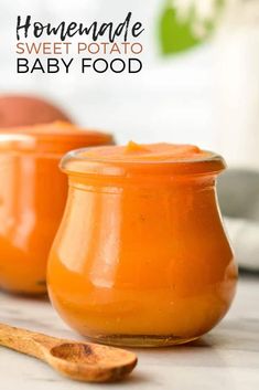 homemade sweet potato baby food in small glass jars with wooden spoons on the side