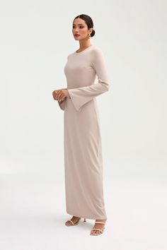 Introducing the Ella Ribbed Split Cuff Maxi Dress, a luxurious and versatile addition to your wardrobe. Made with ribbed fabric for a comfortable and stretchy fit, this dress features a split cuff detail and pairs perfectly with an abaya. Elevate your style and make a statement with this elegant and exclusive piece. Model is 5'7 wearing size XS/58" Formal Modest Dresses, Malaysia Outfit, Modest Dress Outfits, White Coat Ceremony, White Dress Formal, Church Fits, Nikkah Dress, Modesty Outfits, Modest Fashion Winter