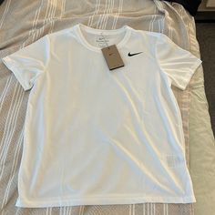 Nike White Dri-Fit Women’s Top Size Medium Nwt 100% Polyester, No Stretch Tops Nike, Nike Shirt, Dri Fit Shirt, Nike Tshirt, Nike Sports, Athletic Shirts, Nike White, Sports Top, Nike Shirts