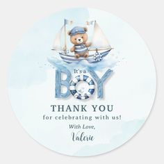 a baby shower sticker with a teddy bear in a sailboat on the water