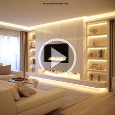 a living room with white furniture and a fire place in the middle of the room