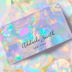 a business card that is on top of some holographics in the background