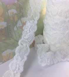 two white lace garters sitting next to each other