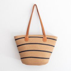 Rattan Basket Beach Bag For Vacation, Straw Shoulder Bag With Handles For Vacation, Vacation Basket Bucket Bag In Natural Fiber, Large Capacity Rattan Basket Beach Bag, Natural Fiber Basket Bucket Bag For Vacation, Large Capacity Paper Straw Bag For Everyday Use, Everyday Straw Bucket Beach Bag, Summer Straw Bucket Bag With Handles, Bucket Straw Bag With Handles For Beach Season