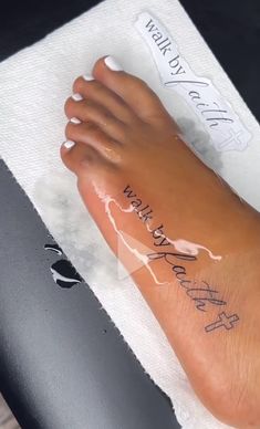 a person's foot with writing on it