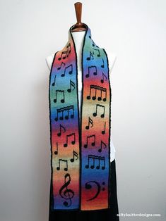 a multicolored scarf with musical notes on it