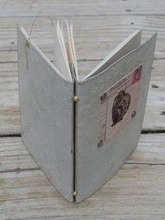 an open book sitting on top of a wooden table