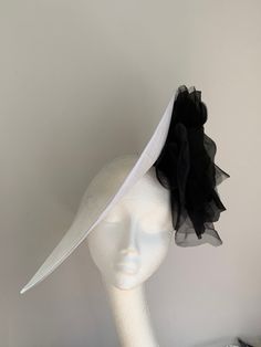 White and black disc hat This amazing white and black hat is made of white sinamay to which I attached black organza and velvet flower. This disc hat will make a statement on any occasion. The hat has a wide headband attached with the comb inside for extra security. Chic White Fitted Costume Hats And Headpieces, White Brimmed Mini Hat For Evening, Chic White Brimmed Fascinator, Chic White Brimmed Top Hat, Chic White Mini Hat With Curved Brim, Chic White Mini Hats With Curved Brim, Chic White Church Hat, White Top Hat For Royal Ascot Races, White Brimmed Top Hat For Royal Ascot