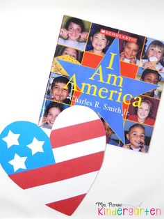 an american flag heart shaped paper cutout next to a children's book cover