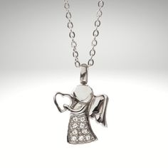 Ships to the USA Beautiful Angel Cremation Pendant, elegant and fine. Pendant comes with charm and  20'' link chain. Made from stainless steel, it is strong, durable, hypoallergenic and guaranteed not to tarnish!  Zen,Healing,Cremate,Crystal, Pet Instructions: Simply open carefully and add a couple specs of your loved ones cremains (you can use a toothpick to help  push the cremains in the chamber) then simply screw close. Warning: DO NOT OVER FILL AND DO NOT OVER TIGHTEN All orders are processe White Gold Crystal Pendant Necklace For Gift, White Gold Pendant Crystal Necklace For Gift, White Gold Crystal Necklace Gift, Silver Crystal Pendant Necklace With Charms, Personalized Silver Crystal Pendant Necklaces, Personalized Silver Pendant Crystal Necklace, Personalized Sterling Silver Crystal Necklace, Ashes Necklace, Urn For Ashes