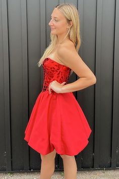 Steal the spotlight in this Stylish A Line Off the Shoulder Red Short Homecoming Dress with Sequins - Aria. Its vibrant red satin fabric exudes an allure that's hard to resist. Dress Aria offers more than meets the eye with its enchanting embellishments. Sequins adorning the dress catch the light beautifully, adding a sparkly touch that is both sophisticated and playful. The dress boasts off-the-shoulder short puffy sleeves, a sweetheart neckline, and a criss-cross back, ensuring that every angl Elegant Red Satin Dress For Cocktail, Red A-line Satin Dress For Prom, Red A-line Dress For Prom Season, Red Satin Dress For Prom, Red Satin Dress For Prom Season, Red Sleeveless Corset Dress For Prom, Sleeveless Red Corset Dress For Prom, Glamorous Red Corset Dress With Sweetheart Neckline, Red Satin Evening Corset Dress