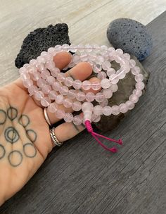 This rose quartz mala necklace has a light pink tone that will be easy to match your everyday outfits and keep you calm and grounded if you use it while meditating. Its a unique decor item also. A perfect gift for a yoga lover, or someone that loves stones. You can use it as a necklace or wrap it around the wrist and becomes a bracelet. The Mala necklace has a drop length of 43cm- 17 inch. A most have addition to your jewelry collection. ⚡️Join Akashi's VIP list for early bird discount access⚡️ Pink Jewelry For Meditation, Spiritual Rose Quartz Jewelry With Round Beads, Pink Spiritual Crystal Necklace For Meditation, Spiritual Pink Crystal Necklaces For Healing, Hand Wrapped Pink Round Beads Jewelry, Pink Hand Wrapped Round Beads Jewelry, Hand Wrapped Pink Round Bead Jewelry, Pink Hand Wrapped Round Bead Jewelry, Rose Quartz 108 Beads Jewelry For Meditation