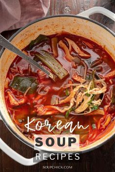 korean soup recipe in a pot with spoons and napkin on the table next to it