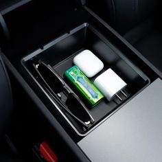 the interior of a car with toothpaste and shaving brushes in it