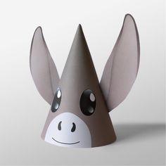 a paper hat shaped like a giraffe's head with eyes and nose