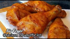 chicken drumsticks on a cutting board with the words air fryer chicken drumsticks