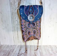 This crossbody hipster bag is the ultimate in sustainable style and beautifully blends rustic charm with western sophistication. It is the mid-size and most popular of our collections. Handmade from recycled cowboy boots Western-chic details and accents Removable crossbody strap for hipster-style wearing Magnetic snap closure to keep your essentials secure Each purse is signed and numbered by the artist. No two alike! Measuring approximately 7"x9" with 48" strap. Saddle up and get ready to make Western Style Bags For Festivals, Western Style Crossbody Bags For Western-themed Events, Western Crossbody Purse, Boot Purse, Totes Boots, Cowboy Boot Purse, Hipster Purse, Hipster Bag, Fringe Handbags