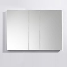 a mirror mounted to the side of a wall