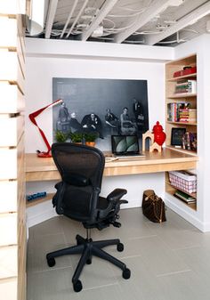 an office area with a desk, chair and book shelf in the corner is shown