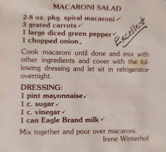 the recipe for macaroni salad is written in cursive writing on paper