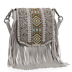 PRICES MAY VARY. Fringe crossbody purse: Made of genuine leather. Vintage floral tooled with embroidered aztec.Criss-cross stitch detail.Antique silver embellishments.Whipstitch on the flap with magnetic button closure. Lobster clasp which can convert to clip bag. Detachable adjustable shoulder straps (48"). Inside of the crossbody includes an open pocket; A zipper pocket on the back. Measured 8'' X 2.5" X 6.5" (Drop 24"). PLEASE NOTE :IT IS SMALL SIZE CROSSBODY BAG. Fringe Crossbody Purse, Leather Fringe Purse, Western Purses, Aztec Fashion, Bag Obsession, Fringe Purse, Crossbody Handbags, Purses For Women, Women Crossbody Bag