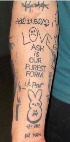 a person's arm with tattoos on it and writing that says love is our purest form