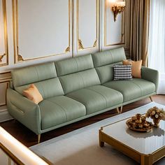 a living room filled with furniture and walls covered in gold framed art work on the walls