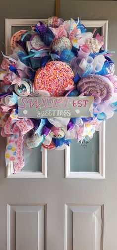 a wreath is hanging on the front door for someone's best birthday gift,