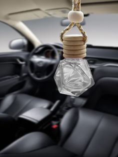 a car dashboard with a light hanging from the ceiling