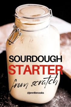 a jar filled with sourdough sitting on top of a table